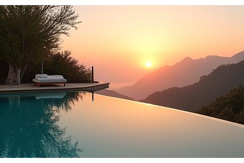 Vue apaisante d'une piscine à débordement donnant sur un paysage verdoyant au lever du soleil, suggérant une retraite zen et luxueuse.